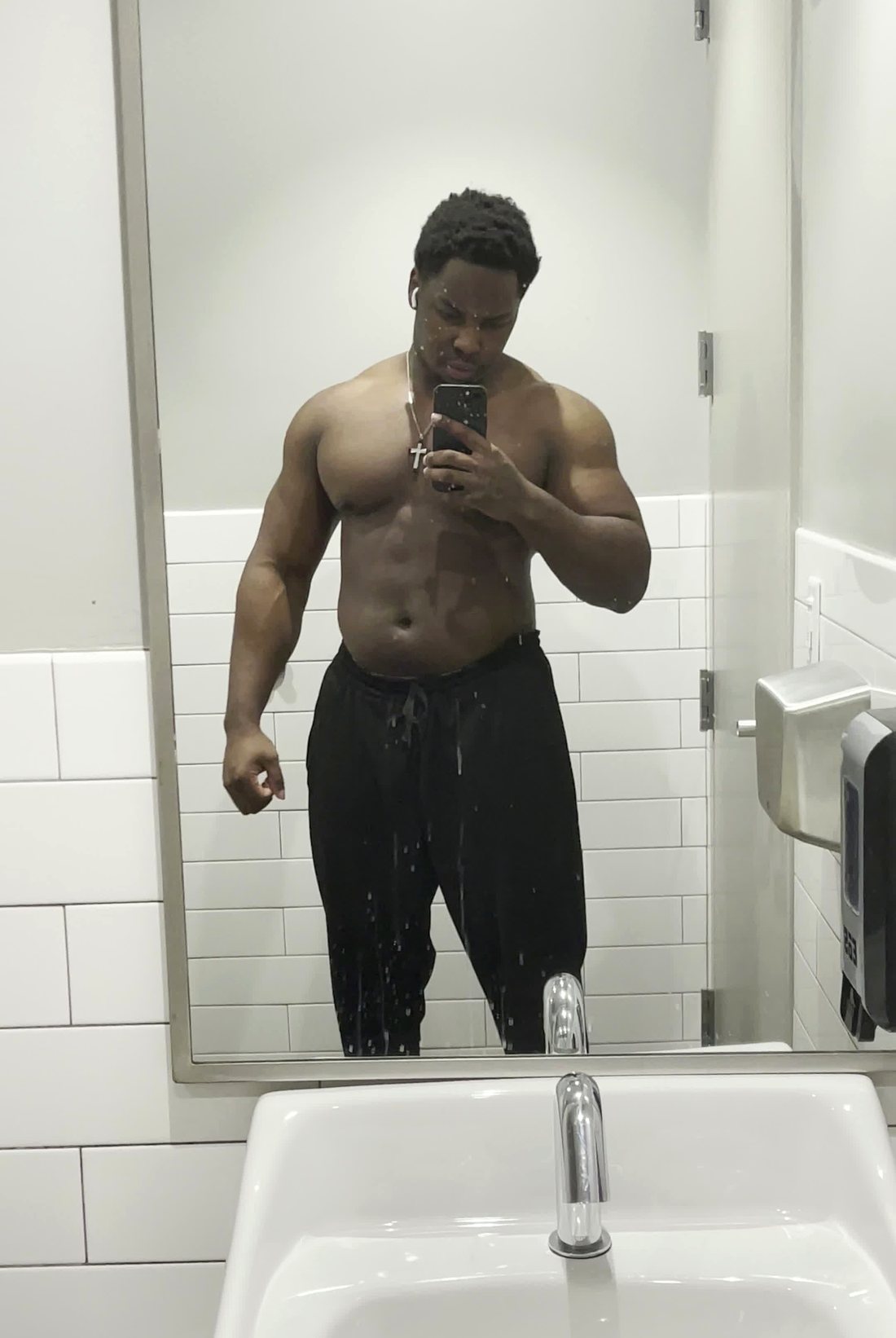 Jamani in the build phase — full and heavy, mid-bulk mirror check